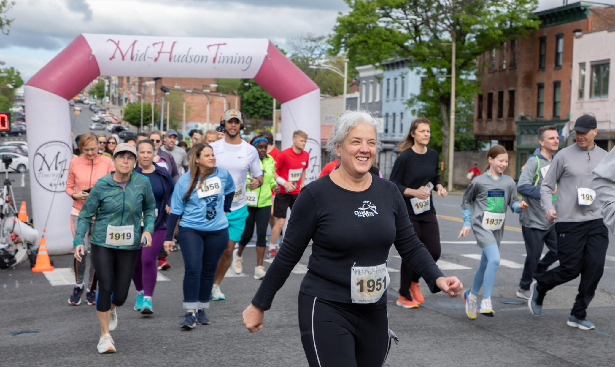 A group of local runners and walkers start a fundraising 5K race on Broadway in Newburgh NY to benefit Safe Harbors of the Hudso part of Spring Into Newburgh event on May 9th 2026